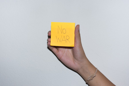 Female hand writing on note paper,selective focus.の写真素材