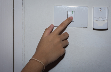 Female hand close switch,selective focus.の写真素材