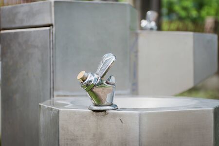 Water tap for drink in park,selective focus.の写真素材