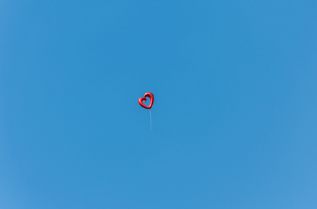  Balloon shape heart on blue sky,far shoot,soft focus.の写真素材