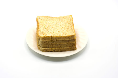 Slice bread on white dish and white background,soft focus.