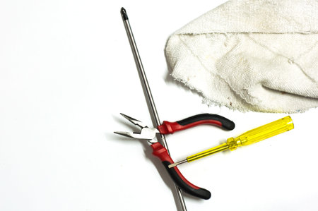 Screwdriver,pliers and other on white background with copy space.