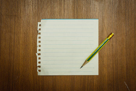 Note paper on desk or background.