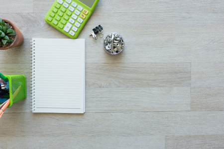 Flat lay of notebook with other on work desk.
