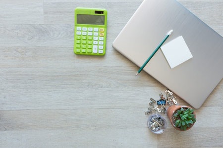 Flat lay of laptop with other on work desk.