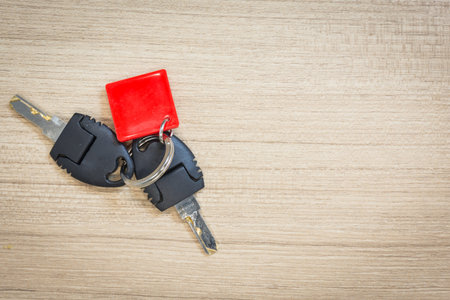 Key on wooden table with copy space.