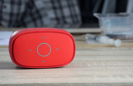 Red speaker on table,soft focus.の写真素材