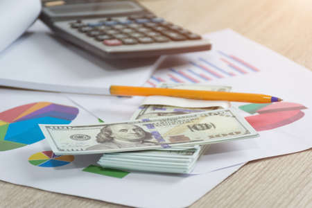 Money and yellow pen with other on desk,Finance accounting concept,selective focus.の写真素材