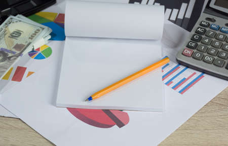 Yellow pen on note paper with other on desk,Finance accounting concept,selective focus.の写真素材
