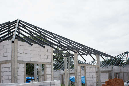 New home before install new roof tile with other in site,selective focus.の写真素材