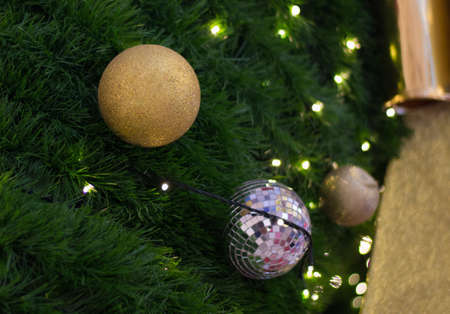 Close up of christmas ball on it's tree,soft focus.の写真素材