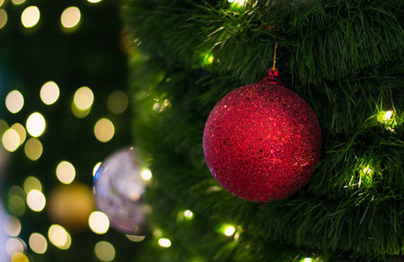 Close up of christmas ball on it's tree,soft focus.の写真素材