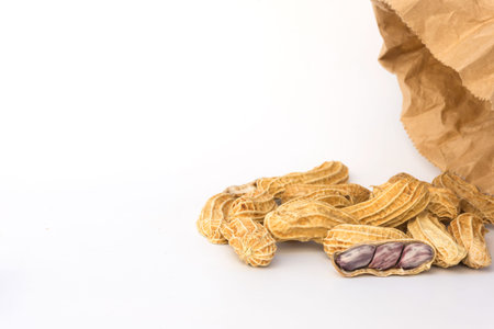 Group of peanut with paper bag on white background,copy space.