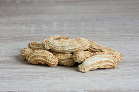 Group of peanut on wooden table background,copy space.
