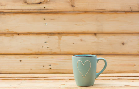 Mug on wooden background.selective focus.の写真素材
