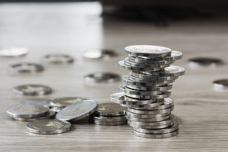 Stack of coin on work table,selective  focus.