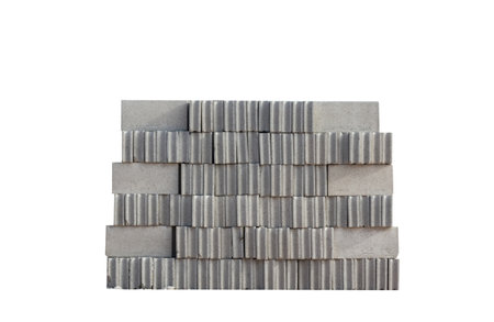 Stack of cement brick block on white.の写真素材