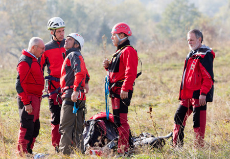 Sofia, Bulgaria - November 6, 2014: Rescuers from Mountain Rescue Service at Bulgarian Red Cross are participating in a training cource which took place at Vitosha mountain near Sofia. The course utilizes techniques for rescuing people from a cabin of a sのeditorial素材