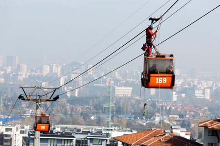 Sofia, Bulgaria - November 6, 2014: Rescuers from Mountain Rescue Service at Bulgarian Red Cross are participating in a training cource which took place at Vitosha mountain near Sofia. The course utilizes techniques for rescuing people from a cabin of a sのeditorial素材