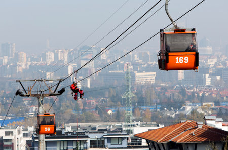 Sofia, Bulgaria - November 6, 2014: Rescuers from Mountain Rescue Service at Bulgarian Red Cross are participating in a training cource which took place at Vitosha mountain near Sofia. The course utilizes techniques for rescuing people from a cabin of a sのeditorial素材