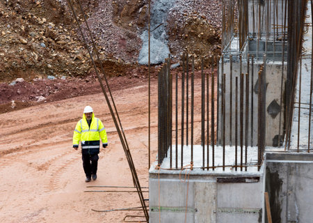 Sofia, Bulgaria - November 24, 2014: An engineer is walking at a construction site of a new waste...