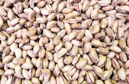 Many pistachios prepared for selling at a Turkish market street.の写真素材