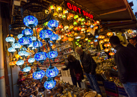 Istanbul - Turkey - November 14, 2014: People are choosing among multiple colorful Turkish lanterns set for sale on a market street in Istanbul.のeditorial素材