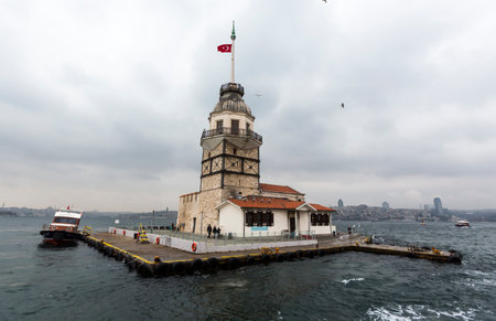 Istanbul, Turkey - November 15, 2014: A boat is leaving Mainden tower built on a small island in Istanbul.のeditorial素材