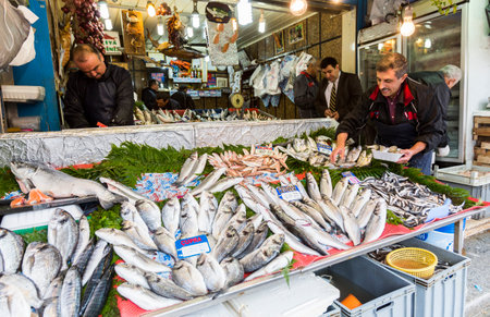 Istanbul, Turkey - November 15, 2014: Sellers are offering Horse Mackerel fish to the tourists at a Turkish market street.のeditorial素材