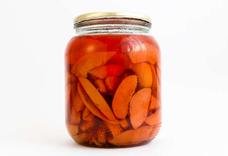 Quinces in a jar isolated on white.の写真素材