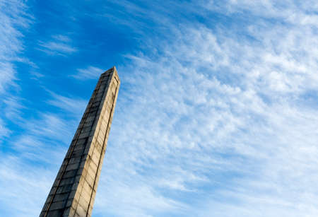A Soviet union monument symbolizing friendship between Bulgaria and USSR against the colorful blue sky with clouds.の写真素材