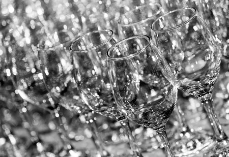 Many empty black and white glasses for water or whine