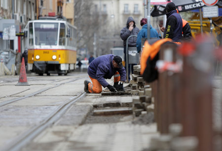 Sofia, Bulgaria - April 7, 2015: Tram road workers are repairing the tram tracks on the tram road.のeditorial素材