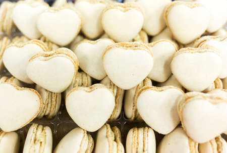 Handmade white heart shaped sweet candies for sale.の写真素材