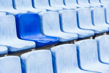 Many blue old seats at a stadium which need replacement.の写真素材