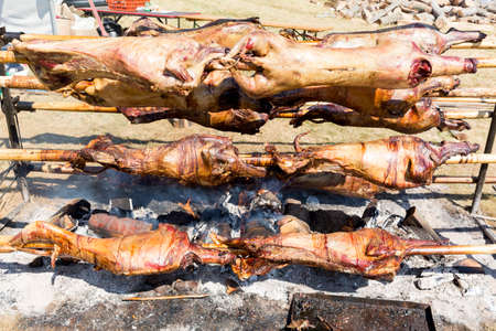 Traditional Bulgarian roasting lamb barbecue. It is roasted meat over an open fire, cooked in a special way. Most often the barbecue is prepared of a ram, lamb, goat or sheep and processed by the slasher.の写真素材