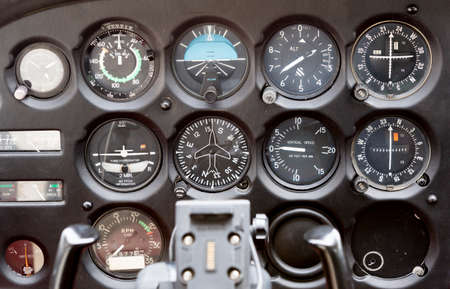 Flight desk control panel on a two-seated old small airplane.の写真素材