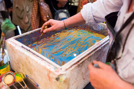 Paper marbling is a method of aqueous surface design, which can produce patterns similar to smooth marble or other stone. Ebru - The art of painting on the water.の写真素材