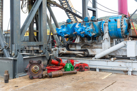A drilling machine in a gas field. Close-up of the head mechanism and parts of the platform.