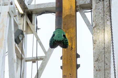 A drilling machine in a gas field. Close-up of the head mechanism and parts of the platform.の写真素材