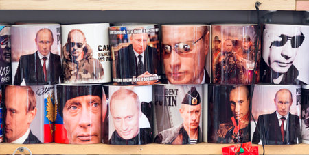 Saint Petersburg, Russia- November 20, 2015: Cups with the image of Vladimir Putin are put for sale for the tourists in Saint Petersburg, Russia.のeditorial素材