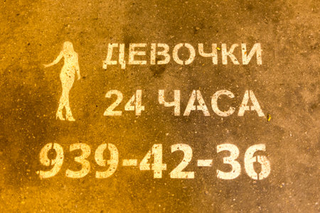 24 hours girls sign in Russian language on the main street in Saint Petersburg, Russia.のeditorial素材