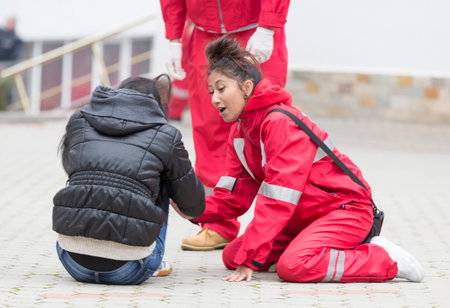 Sofia, Bulgaria - December 5, 2015: Volunteers from the Bulgarian Red Cross Youth Organization are participating in a training of saving people from a building during an earthquake.のeditorial素材
