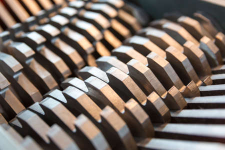 Metal blades of a chopper machine. New sharp blades made of hardened steel. Ready to cut anything. Closeup.の写真素材