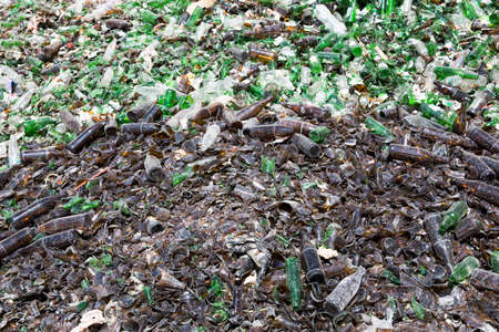 Glass waste for recycling in a recycling facility. Different glass packaging bottle waste.の写真素材