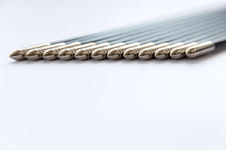 The spikes of a dozen (12) black arrows isolated on a white background.の写真素材
