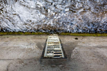 Water level indicator. Water level pole scale from above.の写真素材