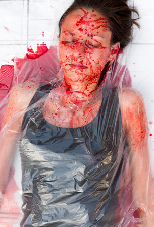 Sofia, Bulgaria - June 21, 2016: Vegans and vegetarians animal rights activists covered themselves in blood and wrapped themselves in meat packaging protesting against killing animals for meat or clothing.のeditorial素材