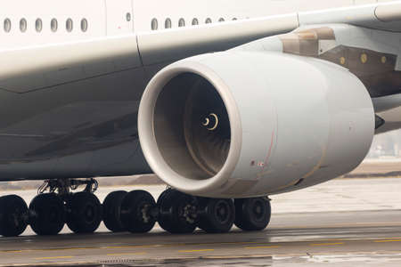 Airplane's engine on a runway at an airport.の写真素材