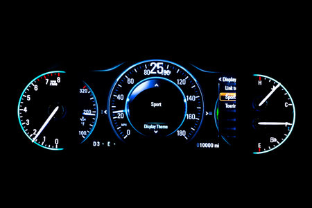 Modern light car mileage (dashboard, milage) isolated on a black background. New display of a modern...